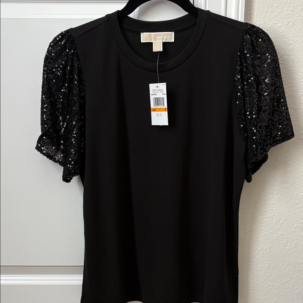 Michael Kors Elegant Black Top with Sequin Sleeves. 95% polyester, 5% eslastane.